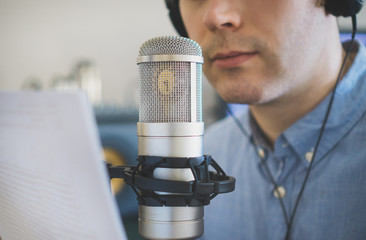 Man recording an advertisement on the radio station.