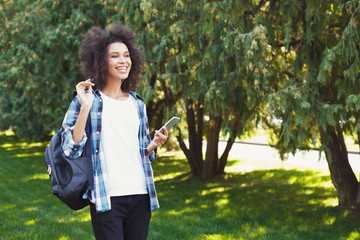 Young woman listening to music outdoors