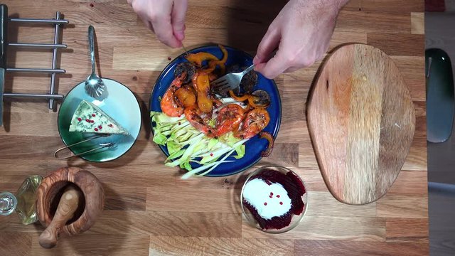 Top view prepare serving plate with shrimps, andive, beet salad and moldy cheese.
