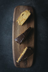 Slices of sweet carrot cake glazed with chocolate,selective focus