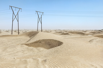 Electric poles the desert.