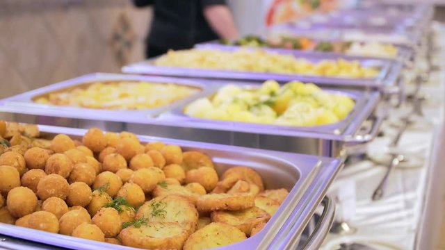 People group catering buffet food indoor in luxury restaurant with meat colorful fruits and.