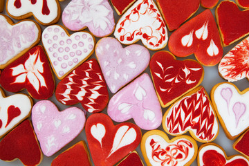 Valentine's day cookies. Heart shaped cookies for valentine's day.Red and Pink Heart Shaped Cookies. Valentine`s Day background. Romantic seamless pattern with cookies hearts.