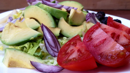 Fresh salad with avocado, asparagus and black olives