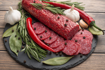 Sausage with salami with rosemary and vegetables.