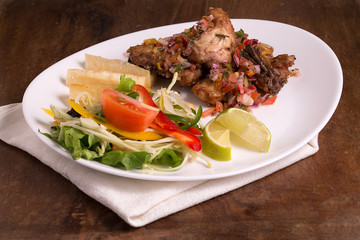 Frango a Passarinho, fried chicken marinated with garlic