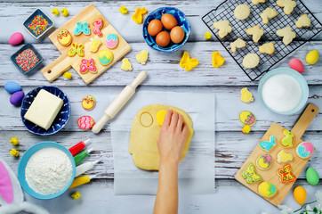 Woman's hand with Sugar dough and ingredients for baking