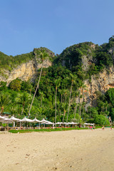 Outdoor view of Huge mountains and people in the beach on Poda island in a gorgeous sunny day
