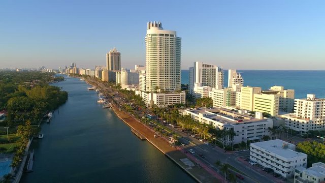 Aerial ascent reveal iconic Miami Beach hotels and condominiums 4k 60p