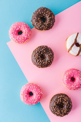 Different donuts on multicolored background