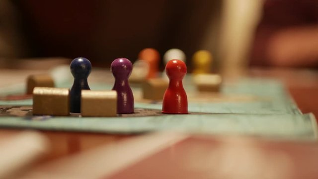 Playing board game with figures close-up
