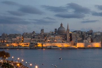 Fototapeta na wymiar Malta - Lights of Valletta from Sliema at dusk.