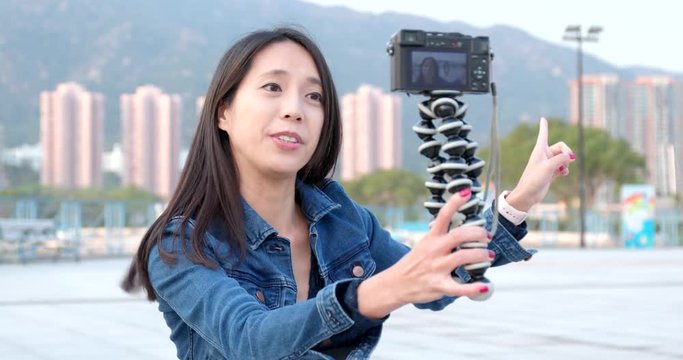 Woman talking on camera for making vlog