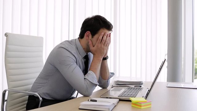 Shocked Young Business Man At Office