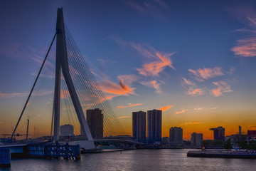 Fototapeta na wymiar Travel Concepts, Ideas and Destinations.Picturesque View of Erasmus Bridge in Rotterdan Before the Sunset. City Scyline with Lights Off.