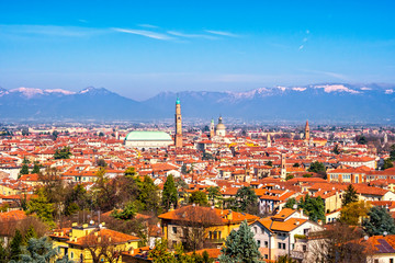 Fototapeta na wymiar Panoramic view of Vicenza. Basilica Palladiana, and Alps mountains. Italy
