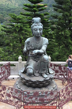 emale disciple statue offering a gift to the Big Buddha at Po Lin monastery, Lantau. 