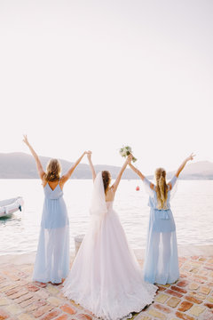 bridesmaids and bride on beach