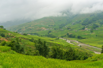 Fototapeta premium Mountain valley with slopes covered with rice terraces