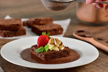 Brownie with chocolate sauce and strawberry