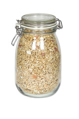 Clear jar of granola and muesli on isolated white background