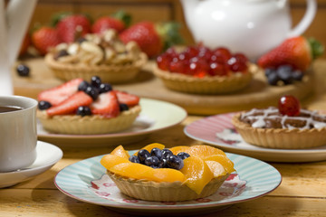 A selection of fruit tarts on table