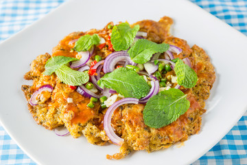 canned fish omelette on table, thai food
