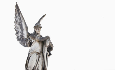 Old stone angel on a light background (religion, Christianity, faith concept)