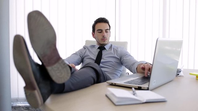 Young Lazy Businessman At Office