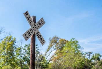 Railroad Crossing Sign and Train Tracks 