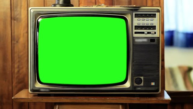 Old Tv with Green Screen. Zoom Out. You can replace green screen with the footage or picture you want. You can do it with “Keying” effect in After Effects  (check out tutorials on YouTube). 