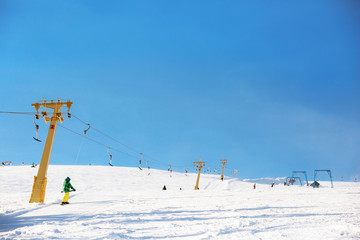 Ski lift at snowy resort. Winter vacation