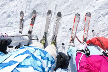 Foto op Canvas Friends on ski piste at snowy resort. Winter vacation © Africa Studio