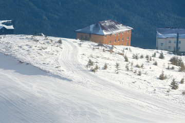 Fototapeta premium Ski slope at snowy resort on winter day