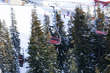 Ski lift at snowy resort. Winter vacation