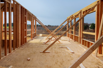 New residential construction home framing against blue sky