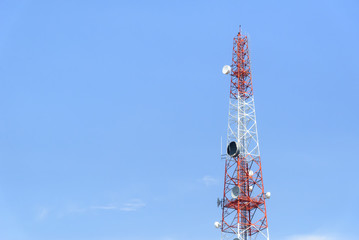 The telecommunication tower with the blue sky.