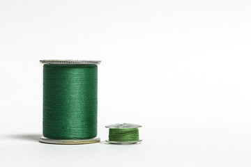 Spool of Green Thread with corresponding Bobbin