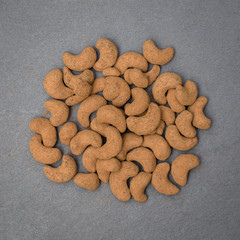 Cashew nuts covered with cocoa powder, close up . Balinese dessert, Indonesia, island Bali