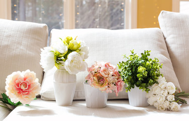A group of flowers in a bright interior room