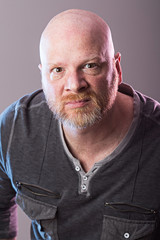 Obraz premium Bald man with an expression of disdain