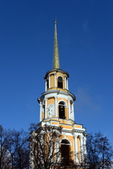 View of belfry of the Ryazan Kremlin against the background of blue sky.