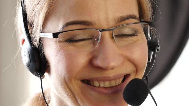 businesswoman working in a call center. customer service proffessional talking on headset. 4K
