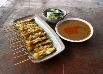 Pork Satay with Peanut Sauce and pickeles food of Thailand