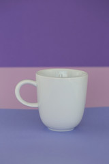 tableware mockup. Minimalist cup Mockup. white cup on a trend lilac pink graphic background. tableware mockup in  pastel tones.copy space