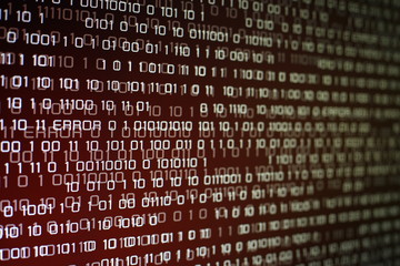 red binary code on computer screen with glittering light and error message. Red binary code...