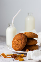 Healthy Breakfast with Oatmeal Cookies, Raisins and Milk on a Light background. Concept Healthy Eating