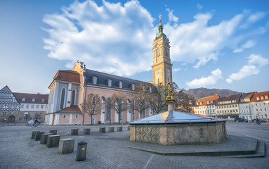 Fototapeta na wymiar St George's Fountain (Georgsbrunnen) and St. George's Church on the main square in the city center of Eisenach, Thuringia , Germany. Eisenach is a town and the main urban center of western Thuringia.