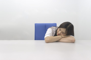 Beautiful Asian office girl napping 
