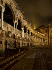 Naklejka premium Spanish Square Plaza de Espana in Sevilla at night, Spain. It is a landmark example of the Regionalism Architecture.